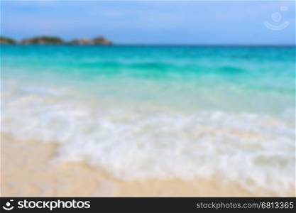 Blur photograph for background, beautiful nature blue sea and white waves on beach in summer at Koh Miang island, Mu Ko Similan National Park, Phang Nga province, Thailand
