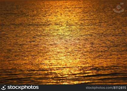 blur sun light impact on sea reflex golden light  abstract nature background