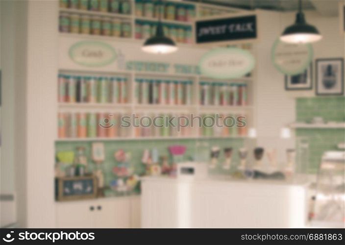 Blurred abstract background dessert shop display interior, vintage tone.