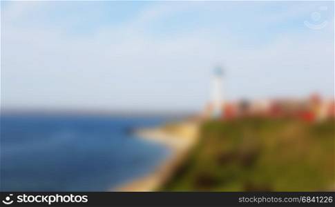 Blurred abstract background of lighthouse at the beach