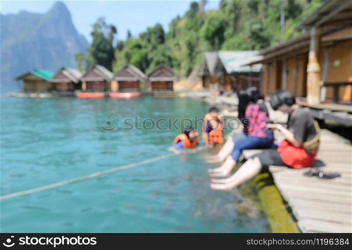 Blurred abstract image of huts with limestone mountain ranges for travel nature background