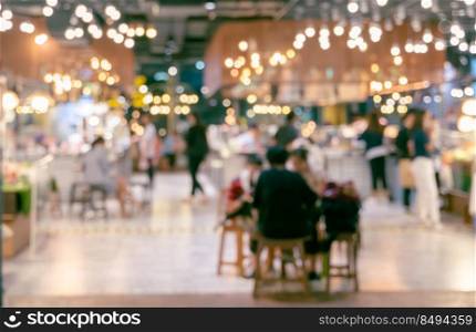 Blurred abstract of cafeteria in University or food court in shopping mall with people background