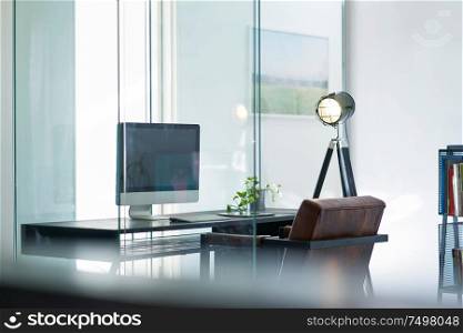 Blurred and defocused office workplace background , for commercial business ads using background .
