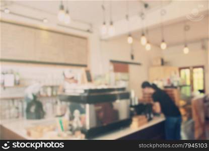 Blurred background : Barista at cafe blur background with retro filter effect
