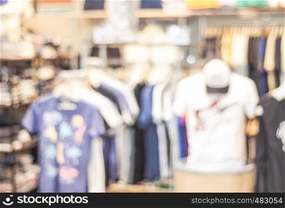 Blurred background, blur display clothing at store with bokeh light, fashion and business background