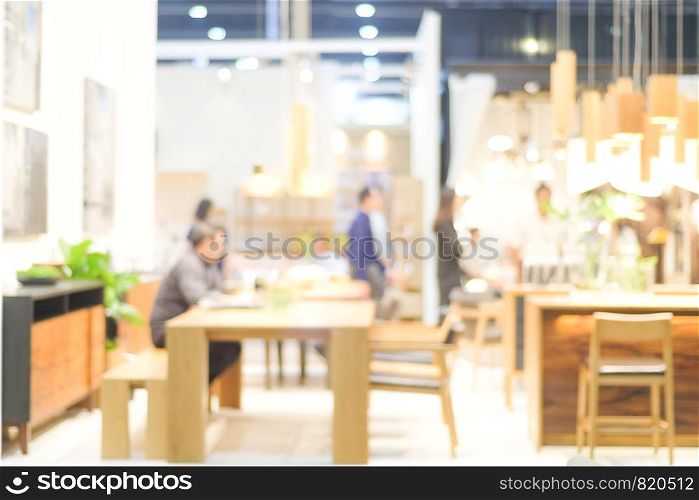 Blurred background : blur group of people team meeting at co-working space background, casual teamwork, business and education concept