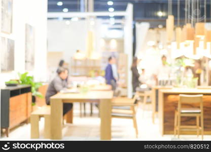 Blurred background : blur group of people team meeting at co-working space background, casual teamwork, business and education concept