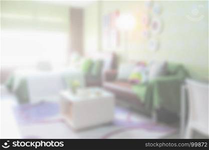 Blurred background colorful bedroom with brown sofa