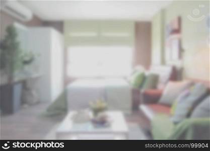 Blurred background colorful bedroom with sofa