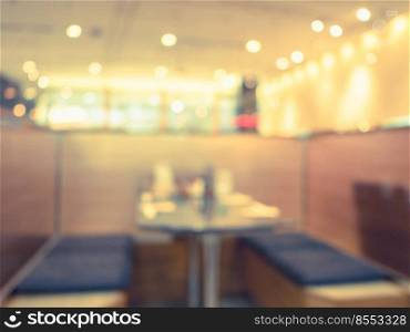 Blurred background, empty table at restaurant blur background with bokeh and vintage tone.