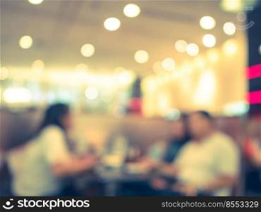 Blurred background, empty table at restaurant blur background with bokeh and vintage tone.