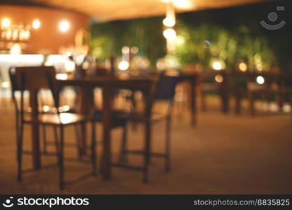 blurred background, empty wood table in coffee shop with bokeh