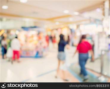 Blurred background image. people at shopping mall blur background with bokeh and vintage toned.