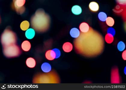 Blurred background of night bokeh concert. Stage lights on concert. Defocused concert lighting. Blur background abstract festival. Blurred stage lights equipment with multicolored beams. Entertainment concert bokeh lighting.