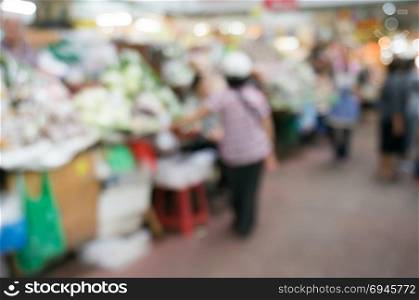 Blurred background of people shopping at night market festival for background usage