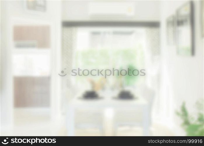 Blurred background of white dining table in modern dining room