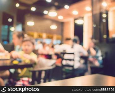 Blurred background, people at restaurant blur background with bokeh and vintage tone.