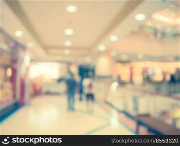 Blurred background, people at shopping mall blur background with bokeh and vintage tone.
