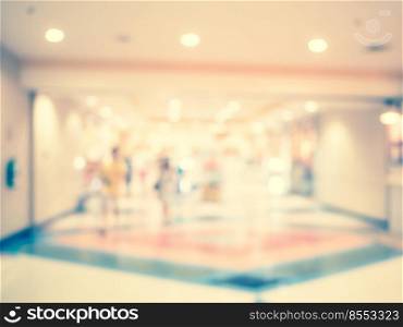 Blurred background, people at shopping mall blur background with bokeh and vintage tone.