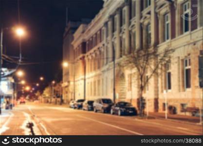 Blurred background - Street night city lights blur. Retro toned photo, Vintage filtered image.