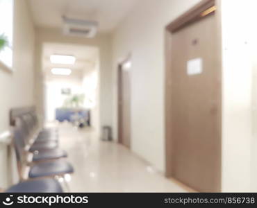 Blurred background waiting room in the doctor's office - chairs in the hallway and the door to the doctor's office