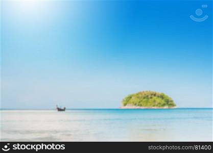 blurred beautiful seascape with blue sea beach island and the long tail boat under clear sky in summer ,kata beach - phuket
