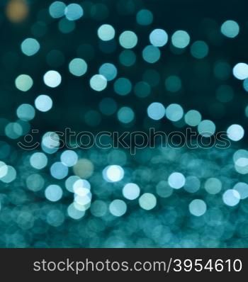 Blurred bokeh background. Beautiful background from blurred lights of interior. Color toned
