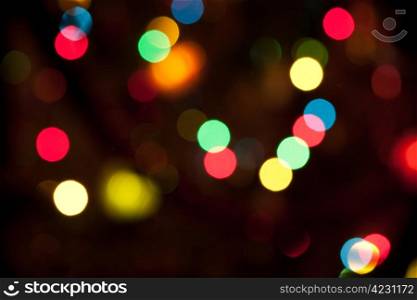 Blurred bright colourful christmas lights abstract background