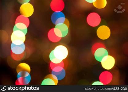Blurred bright colourful christmas lights abstract background