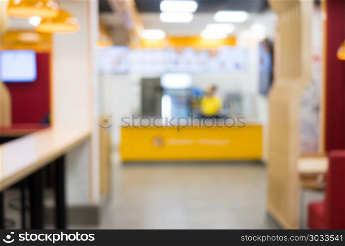 Blurred cafe interior background in vintage tones. Coffee shop blur background with bokeh