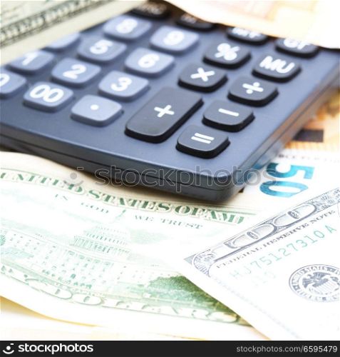 blurred calculator dollar and euro  money background like concept of differences success prosperity and business
