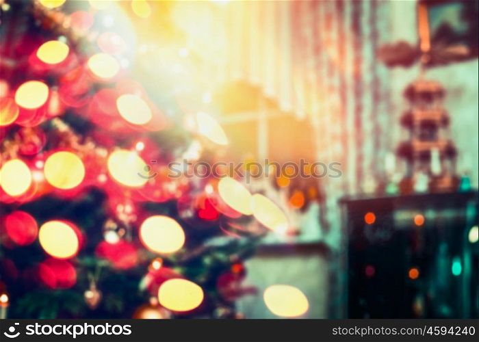 Blurred Christmas background, home scene in room with Christmas tree and holiday bokeh lighting