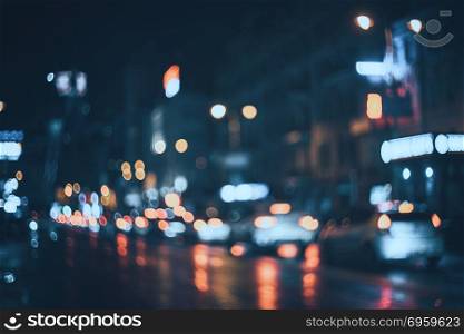 Blurred city at night. Bokeh. Blurred city at night. Bokeh. Beautiful abstract background with defocused buildings, cars, city lights, people. Colorful bokeh background with urban night scene. Design. Concept backdrop. Vintage. Blurred city at night. Bokeh