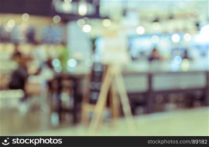 Blurred coffee shop or restaurant background. Retro filtered effect image