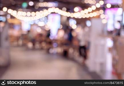 Blurred coffee shop or restaurant interior background with bokeh lights