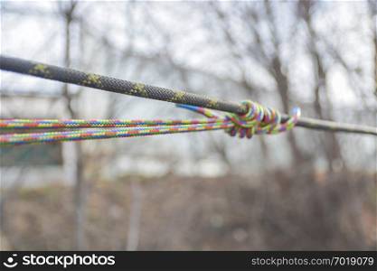 Blurred colored climbing rope and blurred background.