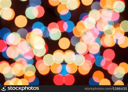 Blurred colorful lights on a black background