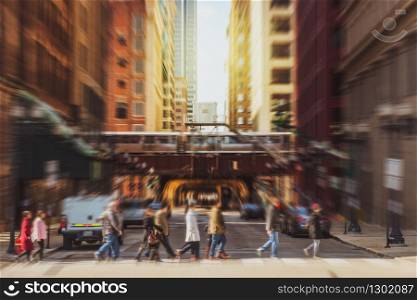 Blurred Crowd of Chicago street with traffic road intersection in rush hour among modern buildings of Downtown Chicago at Michigan avenue, Illinois, United States, blur business and people concept