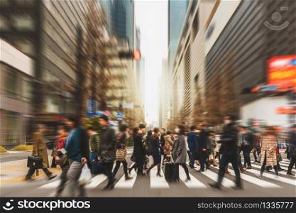 Blurred Crowd of unrecognizable business people walking on Zebra crossing in rush hour working day, blur business and people, lifestyle and leisure concept,