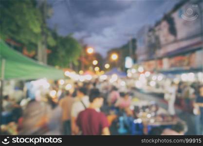 Blurred crowded people at chiangmai night market walking street,Thailand