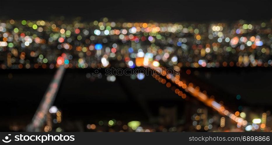 Blurred downtown background with colorful city lights bokeh at night