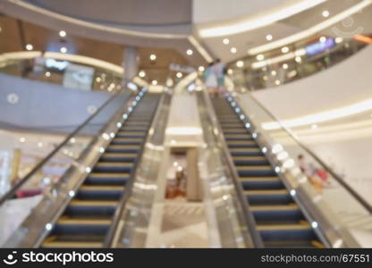 Blurred empty escalator in shopping mall