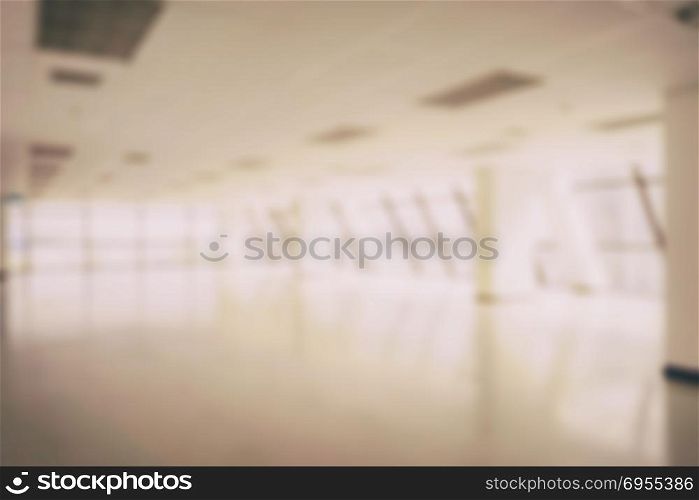 blurred empty office space in high rise building for background
