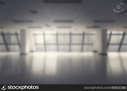 blurred empty office space in high rise building for background