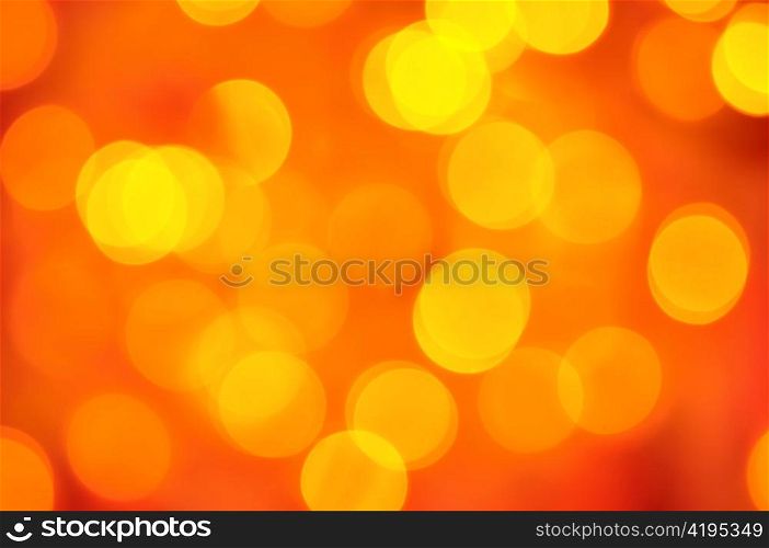 blurred golden lights on red background