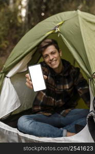 blurred happy camping man forest