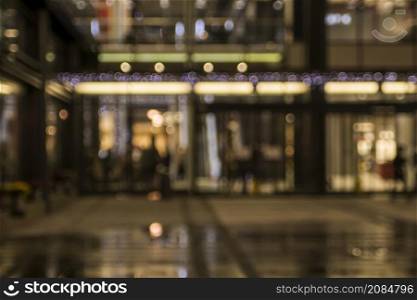 blurred illuminated retail stores