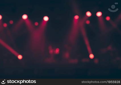 Blurred image background of red stage lights. Party, concert and entertainment concept