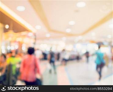 Blurred image background, people at shopping mall blur background with bokeh and vintage tone.