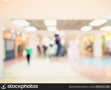 Blurred image background, people at shopping mall blur background with bokeh and vintage tone.